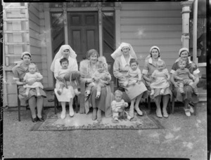 Nurses and children at St Barnabas' Home, Khandallah, Wellington