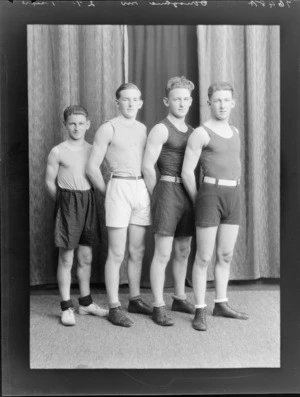 Four unidentified boxers or wrestlers