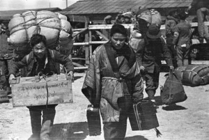 Korean repatriates loaded with belongings