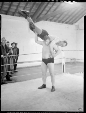 George Walker demonstrating a hold with an unidentified wrestler at Koolman's Gym, Wellington