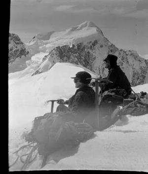 Stereographic image 1, two unidentified mountaineers on [Hochstetter Dome?] at the head of the Tasman Glacier with Mount Elie De Beaumont beyond, Aoraki/ Mount Cook National Park, Canterbury Region