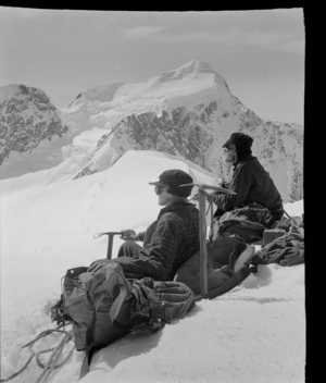 Stereographic image 2, two unidentified mountaineers on [Hochstetter Dome?] at the head of the Tasman Glacier with Mount Elie De Beaumont beyond, Aoraki/ Mount Cook National Park, Canterbury Region