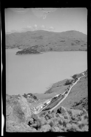 View from a Port Hills rock outcrop to Governors Bay Road and a [military barracks?] above Rapaki Bay, Lyttelton Harbour, Banks Peninsula, Canterbury Region