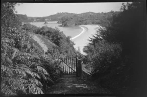 View of gate, looking out to beach and bay, including hills in the background, Stewart Island (Rakiura)