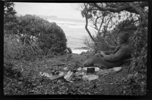 William Williams having a picnic on a beach, with view out to bay, Stewart Island (Rakiura)
