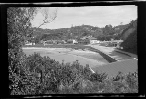 Oban, Half Moon Bay, Stewart Island (Rakiura), showing beach, buildings and store on corner