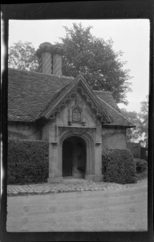 Entrance of the gatehouse at Fulham Palace in London, including crest on top of doorway and ornate spiral design chimney, London, England