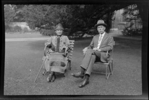 Lydia and William Williams sitting in chairs, on a lawn, Oxford, England