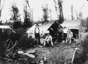Men alongside a camp