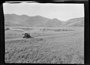 Service car on a road through farmland, Hamner Springs, Hurunui district, Canterbury region