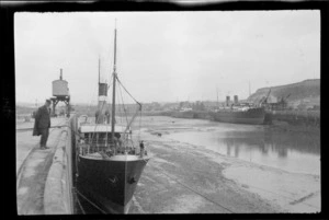 Ships at unidentified wharf at low tide, Morbihan, Brittany, France