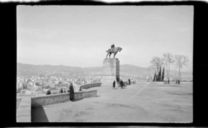 Statue of a horse and rider in park overlooking city, Barcelona, Spain