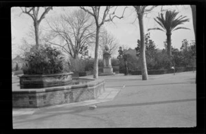 Ornamental pool, with centre garden in park, including Lydia Williams near a memorial statue, Barcelona, Spain