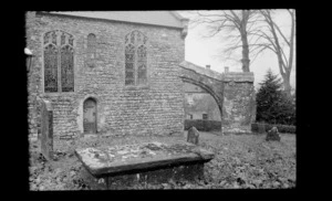 Old stone church, with a half arch attached, including headstones and gravestone, [Neul?] Switzerland