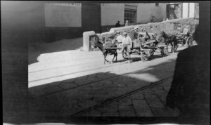 Unidentified men and boys on a donkey cart and horse carriage, Naples, Italy