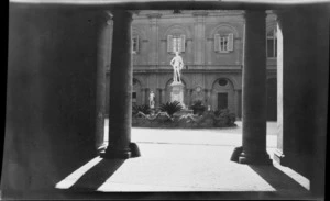 Statue with garden surround, Palazzo Odescalchi courtyard, Rome, Italy
