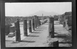 Row of columns and ruins of buildings, Pompeii, Campania region, Italy