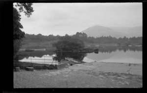 Lake scene, one of the lakes of Killarney, including row boats in river, trees, shrubs and mountain in background, Killarney, County Kerry, Ireland