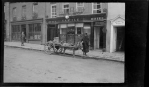 Street scene, woman with donkey and cart, outside of Castle Hotel, Killarney, County Kerry, Ireland