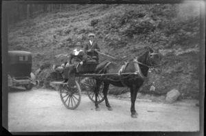 Lydia Williams on horse drawn cart with driver in country lane, Killarney, County Kerry, Ireland
