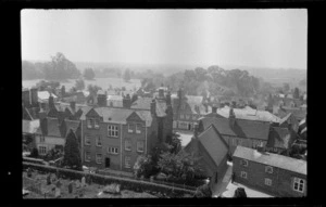 Elevated view of a village, probably taken from St Lawrence church tower, looking out across houses towards fields beyond, Winslow, Aylesbury Vale district, Buckinghamshire, England