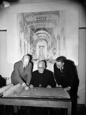 Mr Cecil Wood (architect), Rt Rev H St Barbe Holland (Bishop of Wellington) and Mr Will Appleton (Mayor of Wellington) with plans for proposed Wellington Cathedral
