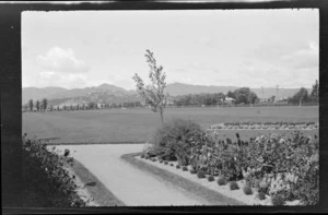 Park with grassed playing field and gardens, location unidentified