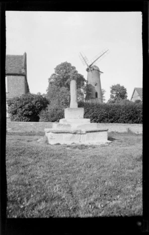 Layered square stone monument, with windmill and plinth behind, Buckinghamshire, United Kingdom