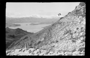 Hillside stipled with snow, with view of [Lyttelton?] harbour, [Port Hills, Canterbury region?]