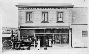 The store fronts of two Wellington businesses: John Edward Evans, saddler and A Bird, greengrocer