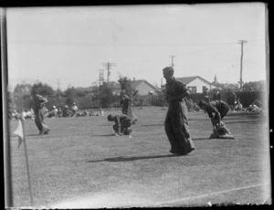 Male students, all unidentified, competing in a sack race at Westport Technical High School, West Coast Region