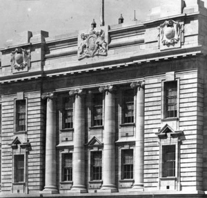 [Side view of Parliament Buildings, showing coat of arms]