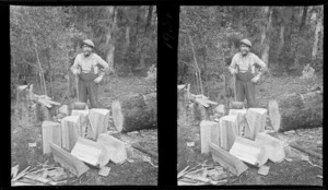 An unidentified man smoking a pipe, holding a mallet, standing in the bush next to a split log, [West Coast Region?]