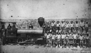 Photographer unknown: Class `C' locomotive and a railway construction gang on the Taranaki line