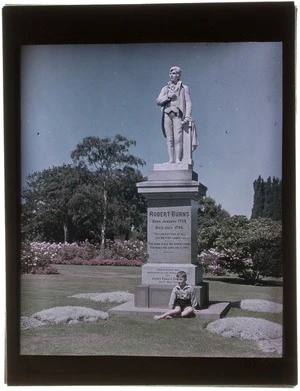 Statue of Robert Burns, Timaru Botanical Gardens, Canterbury Region, showing an unidentified boy sitting on base of statue