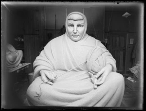 Sculpture of a woman wearing robes holding a ball of yarn, by Francis Shurrock