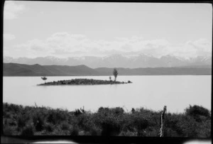 Lake with small island, mountain range beyond, [Lake Te Anau, Southland?]
