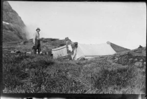 [Samuel Turner?] at a campsite on a mountain-top, view beyond obscured by cloud, [Fiordland National Park or Canterbury Region?]