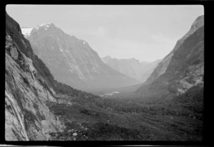 Bush-clad river valley [Hollyford Valley?] surrounded by mountains, Southland District