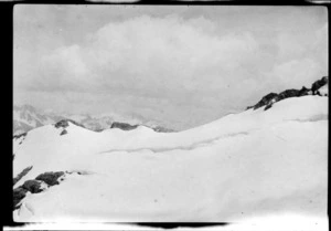 Snowy landscape, with mountains beyond, on Mount Rolleston, Arthur's Pass National Park