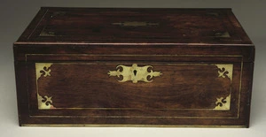 [Maker unknown] :[Wooden writing desk with brass fittings, formerly the property of J. F. Hoggard, Wellington's second postmaster. Made in the mid-nineteenth century?] [Closed view, square on]