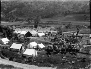 Scene at Waipiro Bay with tents and horse drawn carts