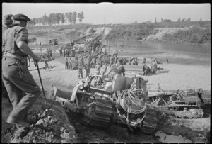 Kaye, George F, 1914- (Photographer) : Scene during World War 2, showing a bulldozer approaching the Reno River, Italy, where the Bailey bridge is under construction