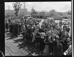 Crowd standing next to railway track in The Square, Palmerston North, to greet Polish refugees enroute to Pahiatua