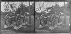 Boys [Edgar Richard and Owen William Williams?] looking at cannon at Clive Square, Napier, Hawkes Bay Region