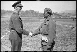 Lieutenant Colonel Arapeta Awatere, New Zealand World War 2 soldier, receiving the Distinguished Service Order from Lieutenant General R L McCreery at Castel Raimondo, Italy