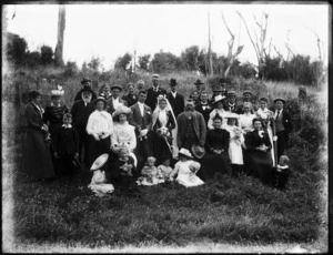 Wedding party in a field, including members of the Robertson family