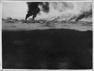 Smoke rising from burning vehicles in Libya, during World War 2 - Photograph taken by Lieutenant Smythe