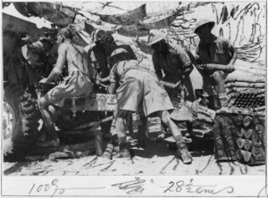 New Zealand soldiers loading a gun near Alum Nyal, Ruweisat, Egypt, during World War 2 - Photograph taken by J Christensen