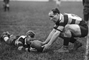 Cliff Porter and Kenneth Svenson, playing rugby